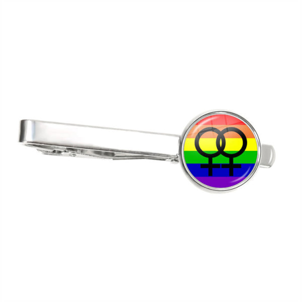 Silver tie clip with a round rainbow badge showing two interlocking female symbols