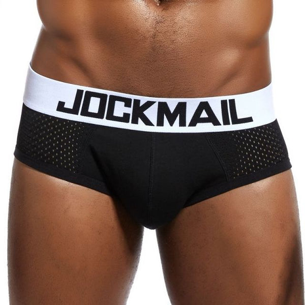 Model wearing black mesh briefs with a white JOCKMAIL logo waistband