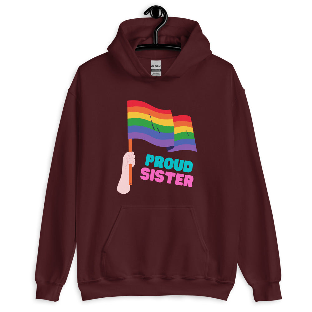 Maroon pullover hoodie with a rainbow flag graphic and “PROUD SISTER” text