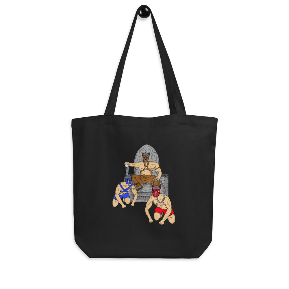 Front view of a black tote bag with an illustrated pup-play scene in blue and red gear