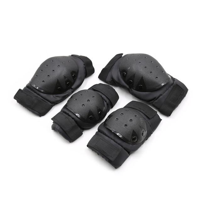 Close-up of four black protective pads with adjustable straps and ventilated hard-shell caps