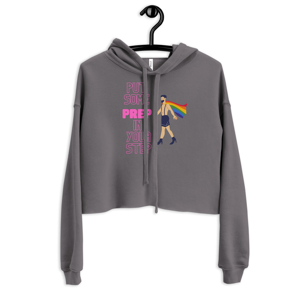 Front view of a gray cropped hoodie reading “PUT SOME PREP IN YOUR STEP,” with a rainbow-caped figure