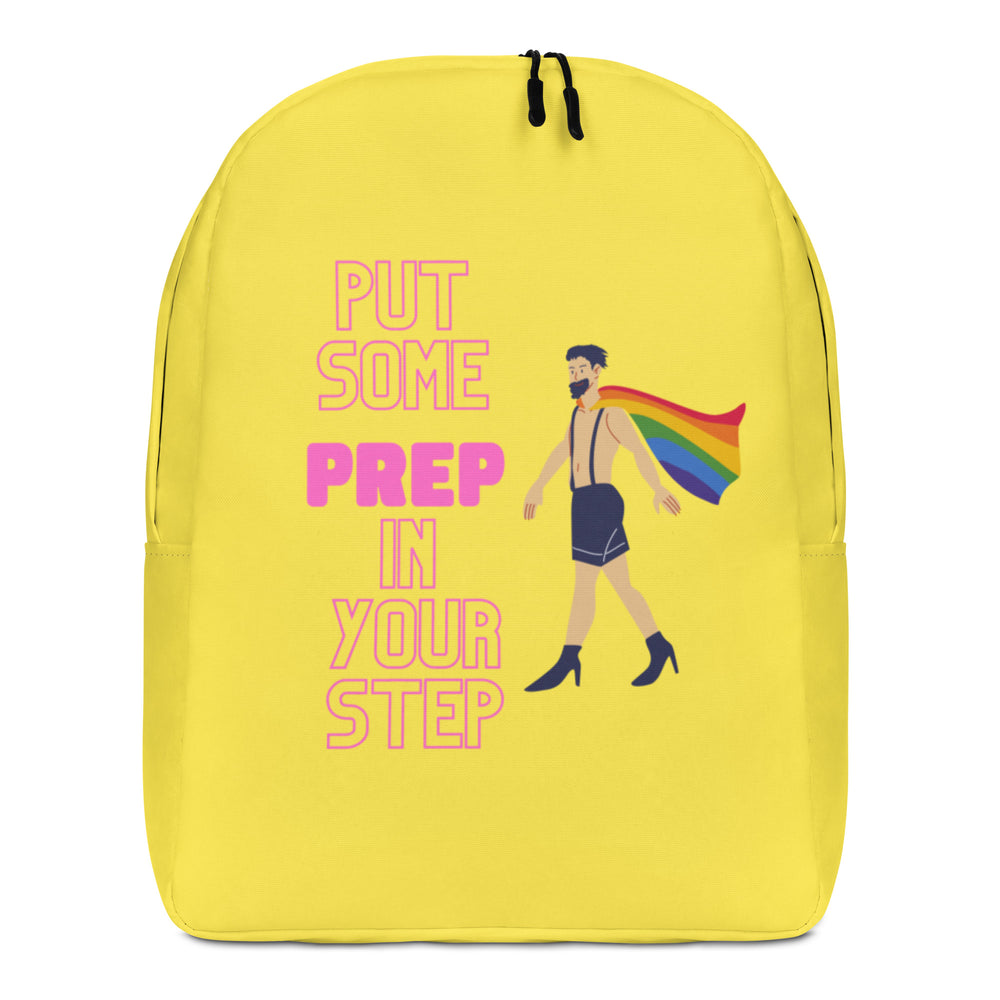 Front view of a yellow backpack reading “PUT SOME PREP IN YOUR STEP,” with a caped figure in heels