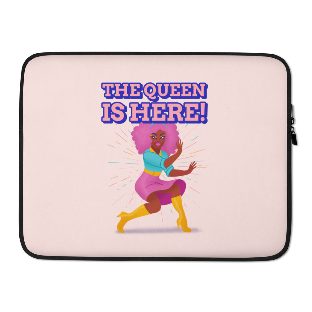 Pink laptop sleeve reading “THE QUEEN IS HERE!” with a colorful dancing woman illustration