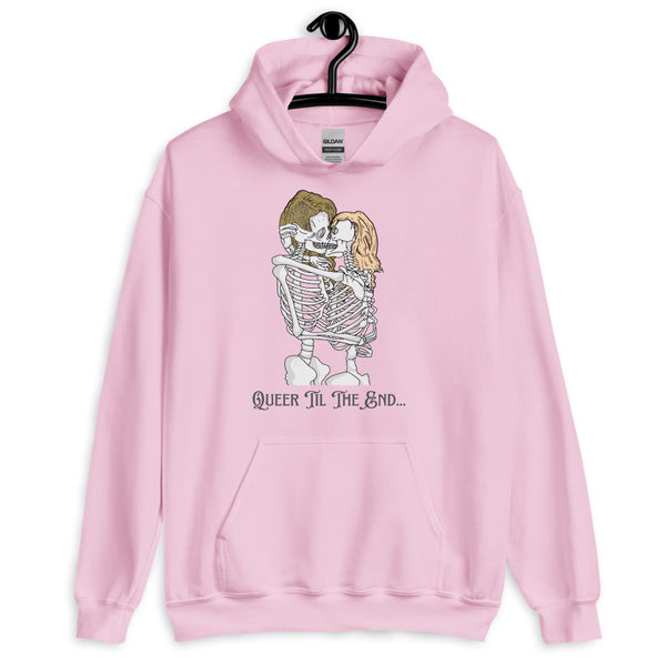 Pink hoodie on a hanger with two kissing skeletons and “QUEER TIL THE END...”