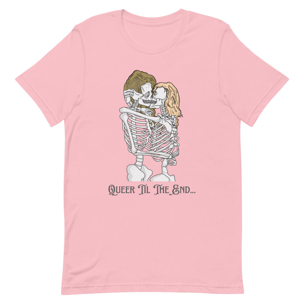 Flat-lay pink T-shirt with two kissing skeletons and “Queer Til The End...” text