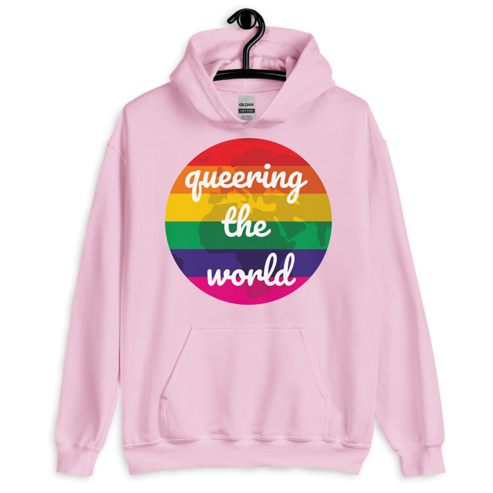 Light pink hoodie with a rainbow circle reading “queering the world”