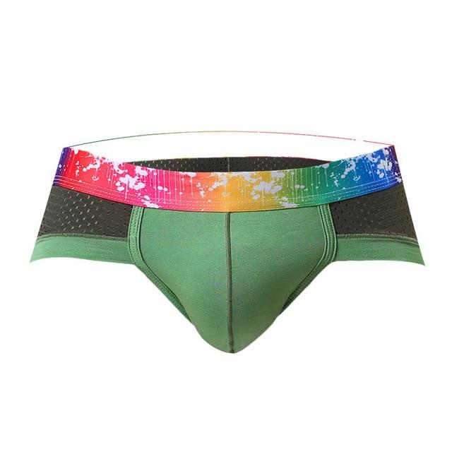 Green sports briefs with black mesh panels and a rainbow splatter-print waistband