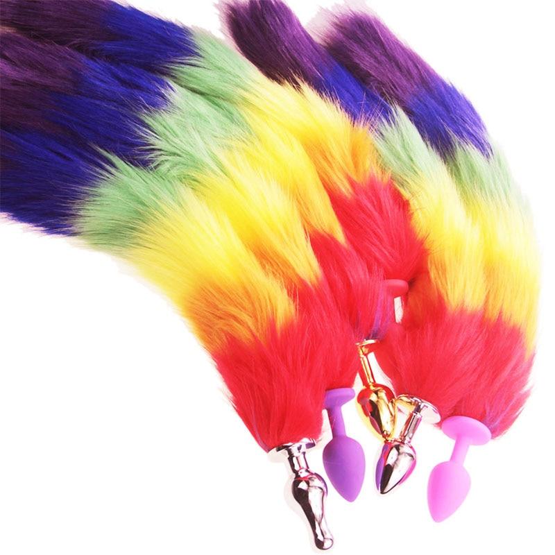 Rainbow-colored furry tail plugs with metallic pointed and pastel silicone ends