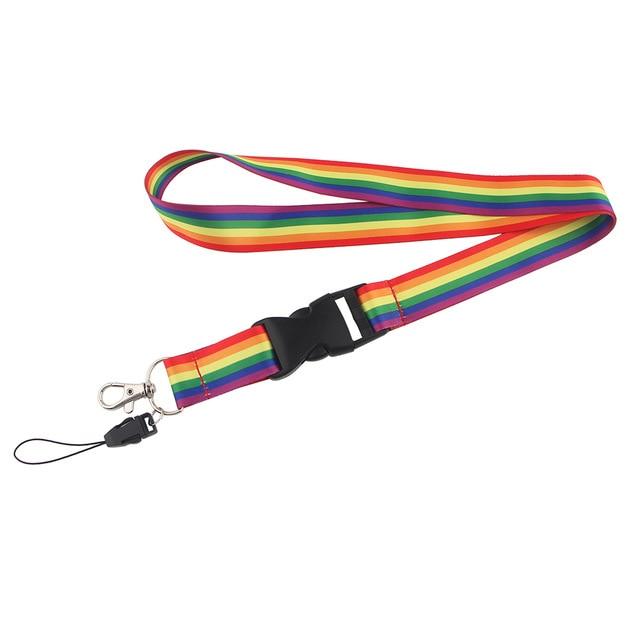 Rainbow Pride lanyard with black buckle, metal clip, and detachable ID-card holder