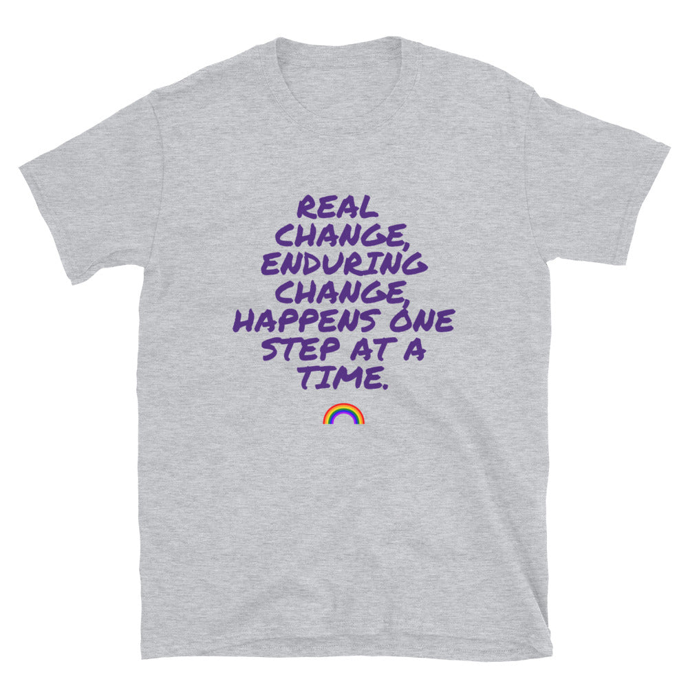 Gray T-shirt with purple text reading “Real change, enduring change...” and a rainbow graphic