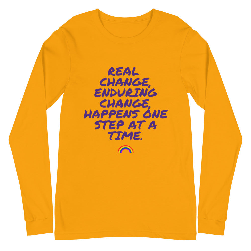 Front view of an orange long-sleeve shirt with purple text and a small rainbow graphic