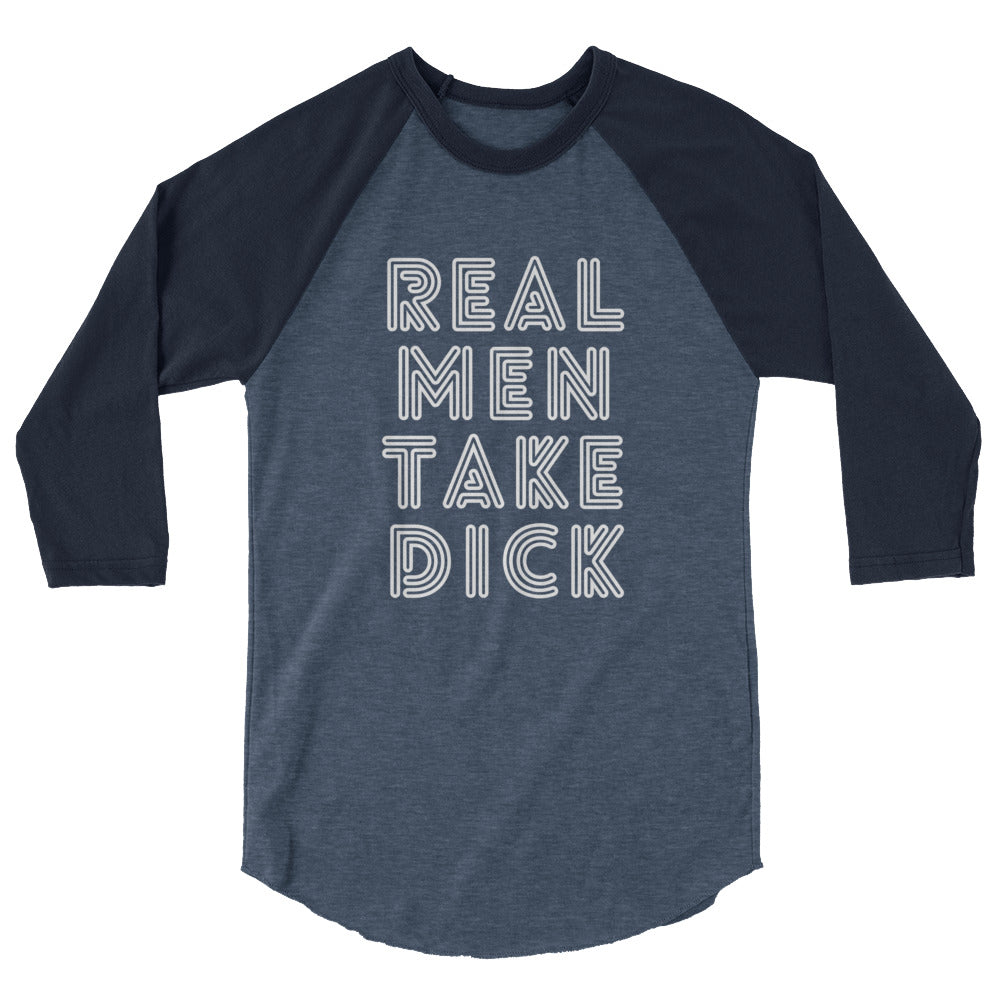 3/4 sleeve raglan shirt with “Real Men Take Dick” worn by a short-haired person dancing at Pride among rainbow flags and confetti.