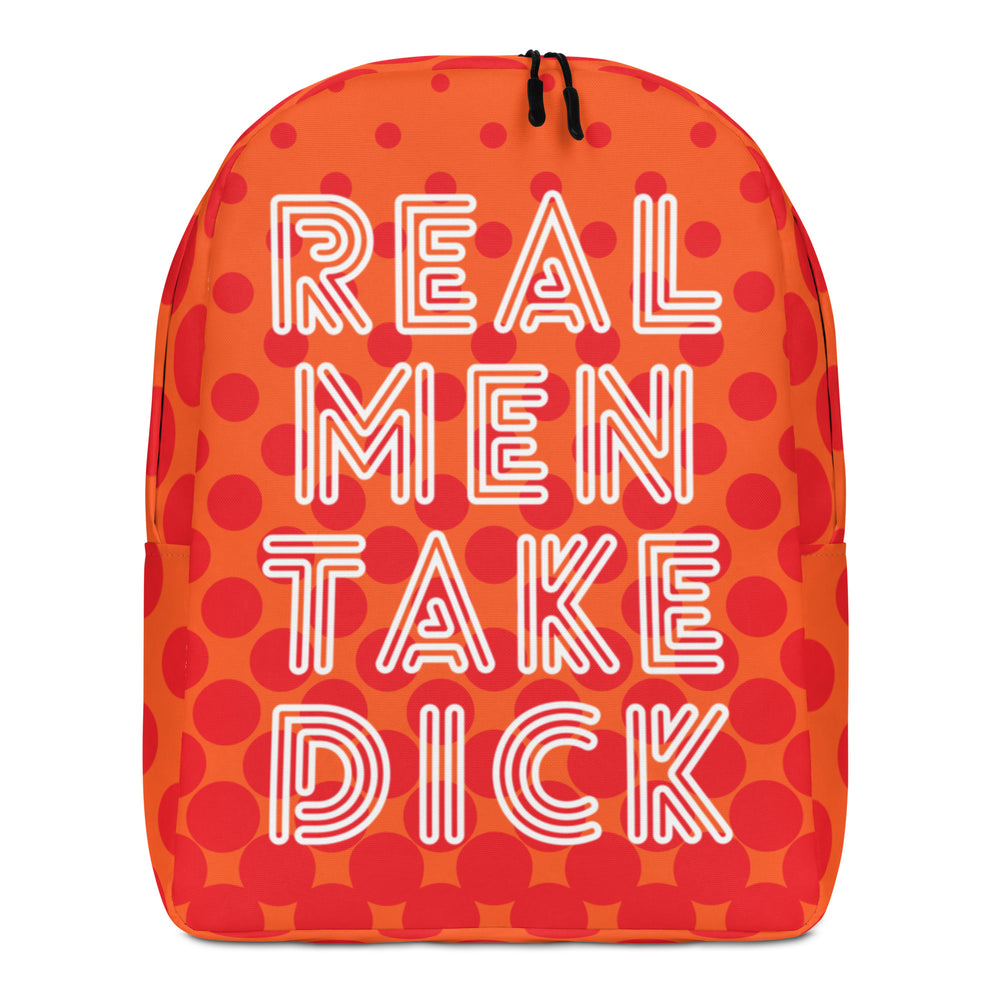 Front view of an orange backpack with red dots and white text reading “REAL MEN TAKE DICK”