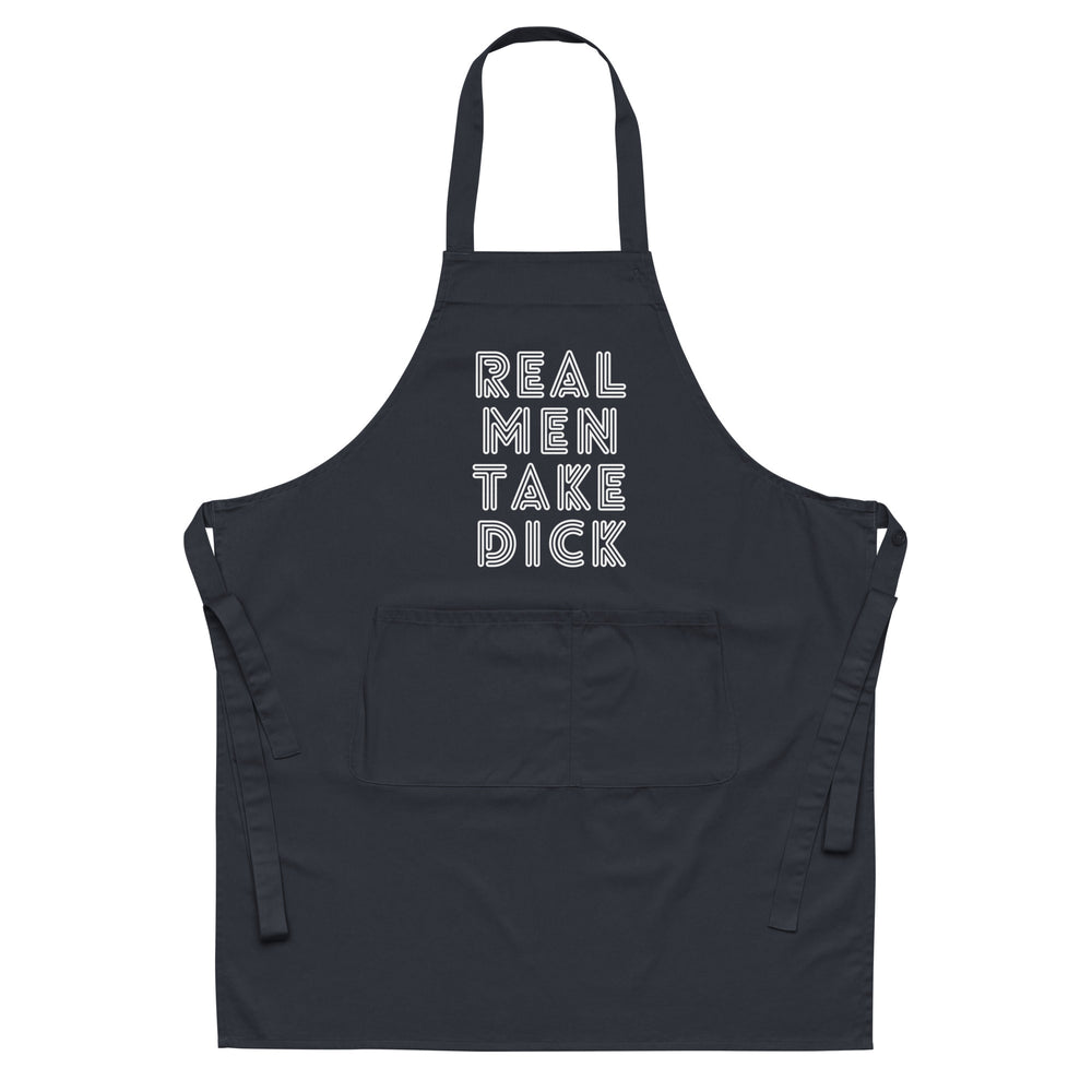 Black apron with white outlined text reading “REAL MEN TAKE DICK” and a large front pocket