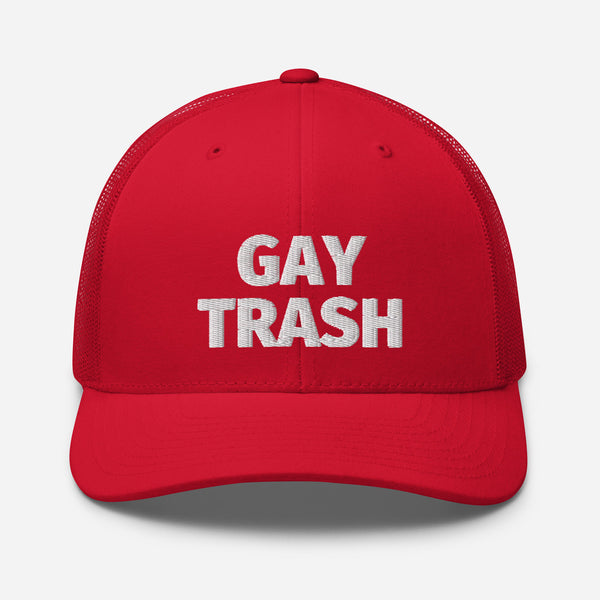 Red trucker cap with white “GAY TRASH” lettering on the front
