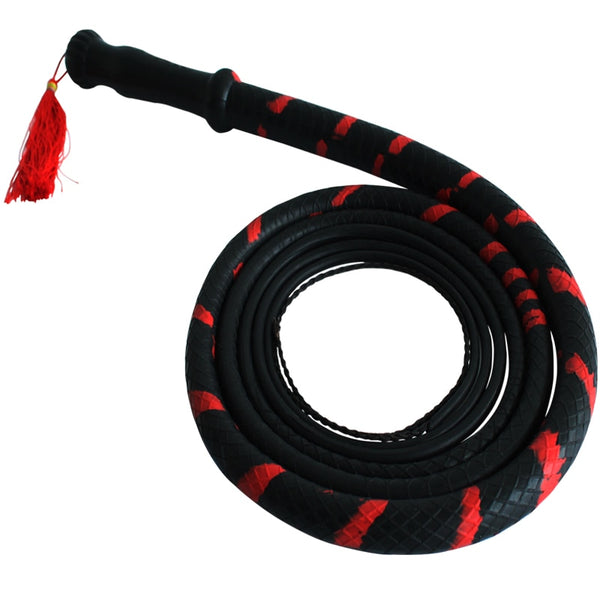 Black and red braided bondage whip coiled beside a black handle with a red tassel