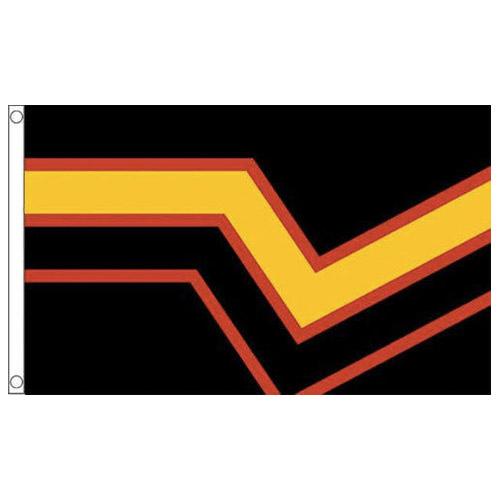Close-up of a black, red, and yellow rubber fetish pride flag with a V-shaped stripe