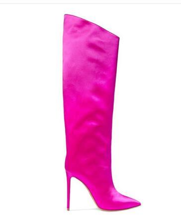 Side view of a hot pink thigh-high stiletto boot with a pointed toe