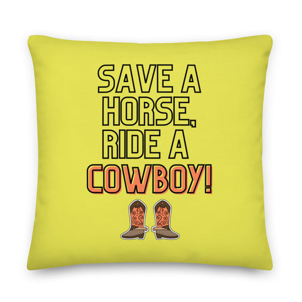 Square lime-yellow pillow reading “SAVE A HORSE, RIDE A COWBOY!” with cowboy boots