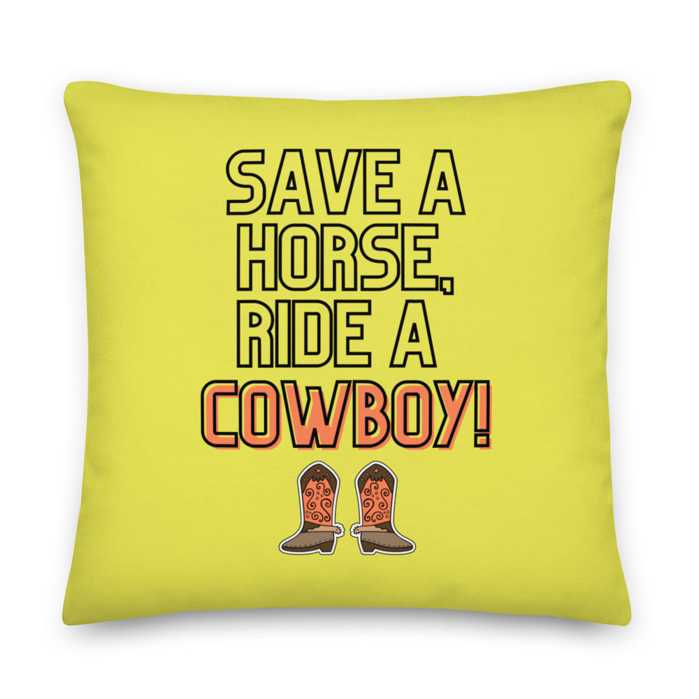 Square lime-yellow pillow reading “SAVE A HORSE, RIDE A COWBOY!” with cowboy boots