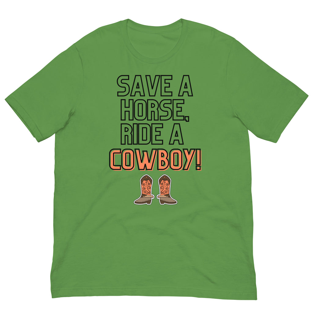 Green T-shirt laid flat with “SAVE A HORSE, RIDE A COWBOY!” and cowboy boots
