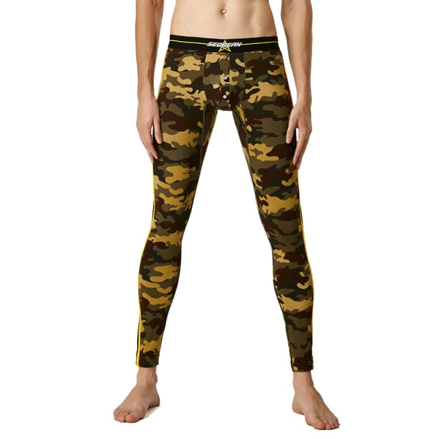 Camo-print full-length leggings with a black elastic waistband, modeled against a white background