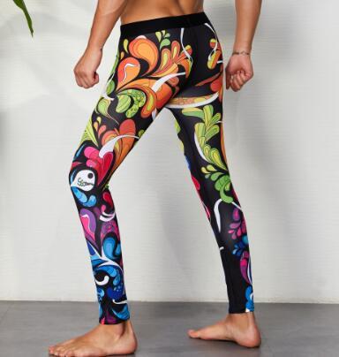 Black leggings with colorful swirling floral and skull-inspired abstract prints, worn by a model