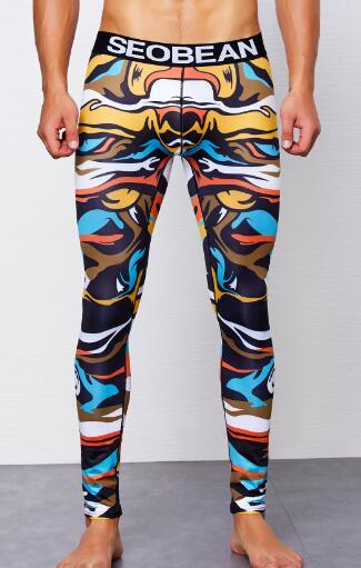 Model wearing colorful abstract-print full-length leggings with a black SEOBEAN waistband