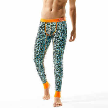 Leopard-print thermal leggings with orange waistband, ankle cuffs, and front drawstring