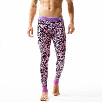 Model wearing purple leopard-print thermal leggings with a contrasting waistband and cuffs