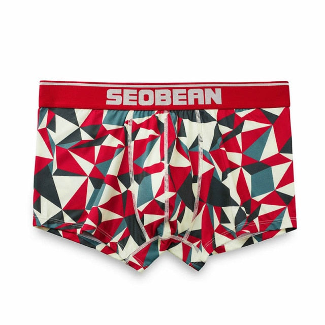 Front view of red, white, teal, and black geometric-print boxer briefs with SEOBEAN waistband