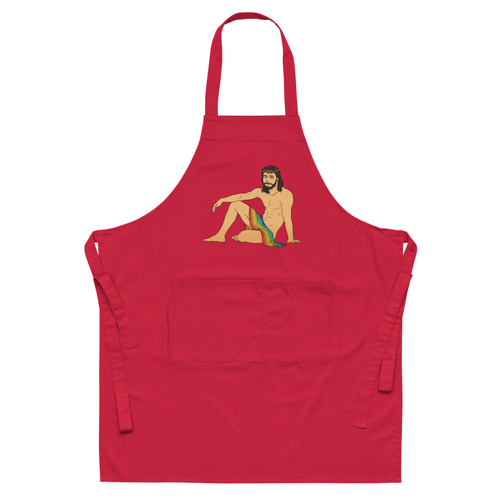 Front view of a red apron featuring a shirtless, bearded Jesus illustration in a rainbow drape