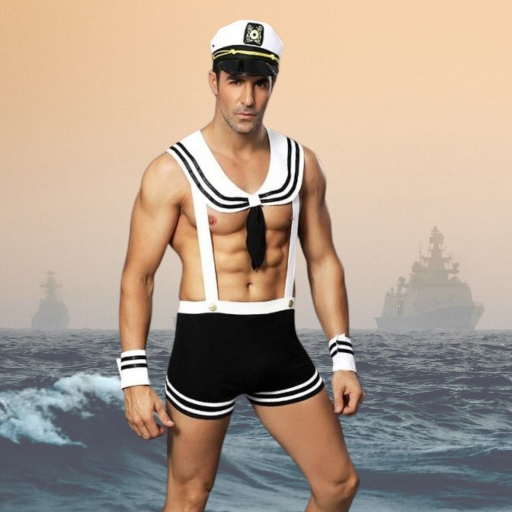 Sailor costume with white cap, striped collar, black tie, suspenders and shorts