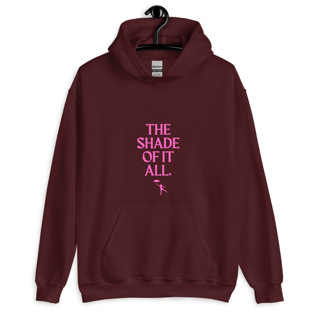 Front view of a maroon hoodie with pink “THE SHADE OF IT ALL.” lettering