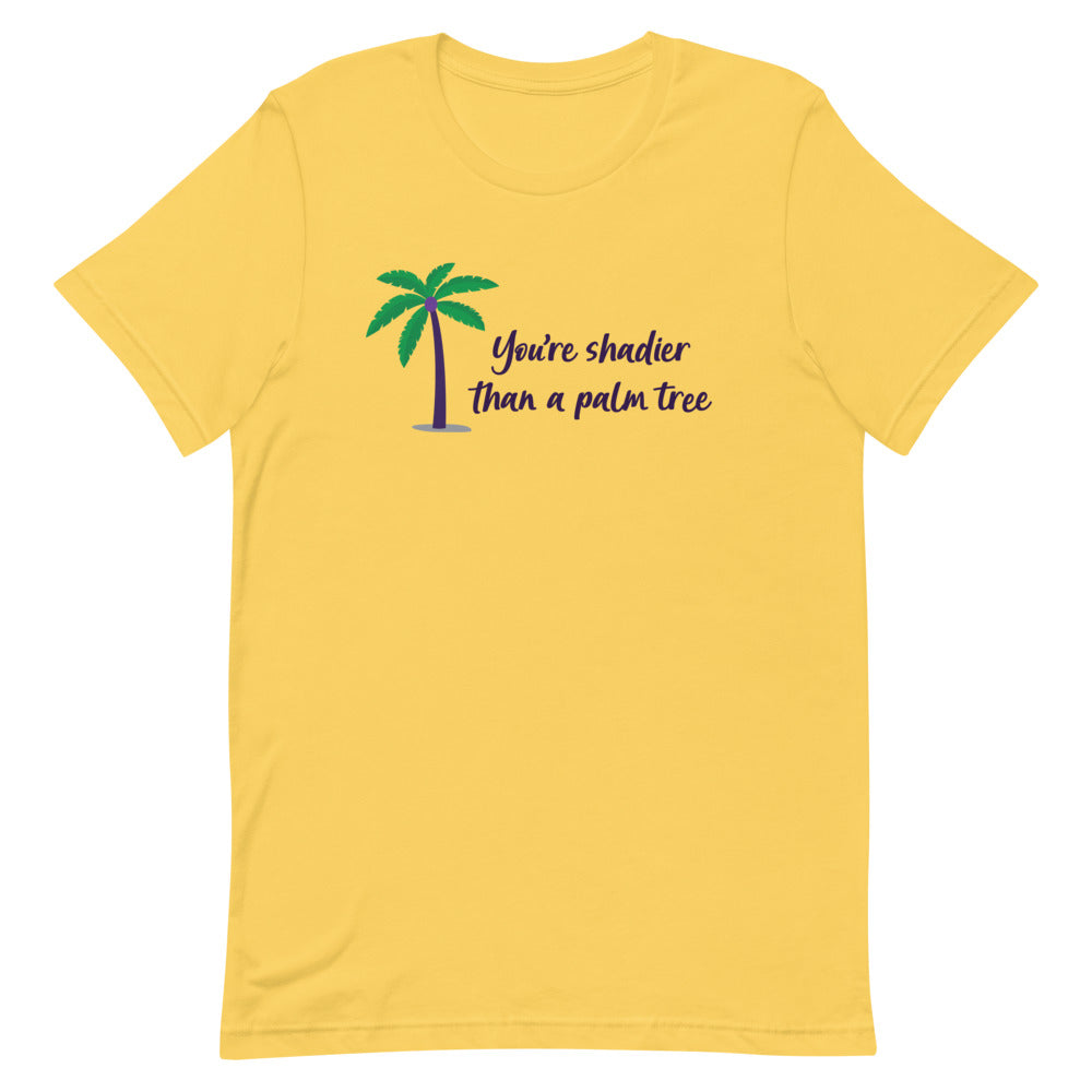 Front-facing yellow T-shirt with a palm tree and “You’re shadier than a palm tree” text