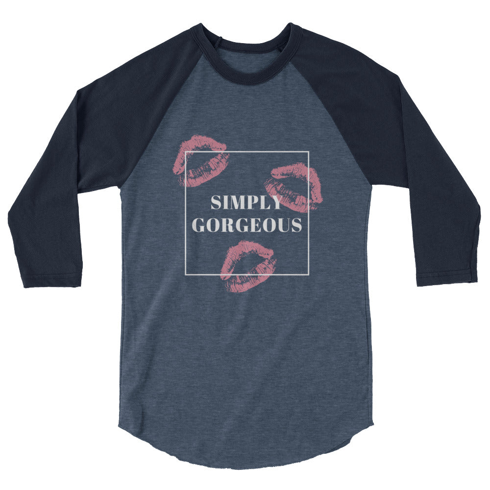 Front view of a navy and charcoal raglan shirt reading “SIMPLY GORGEOUS” with pink lips