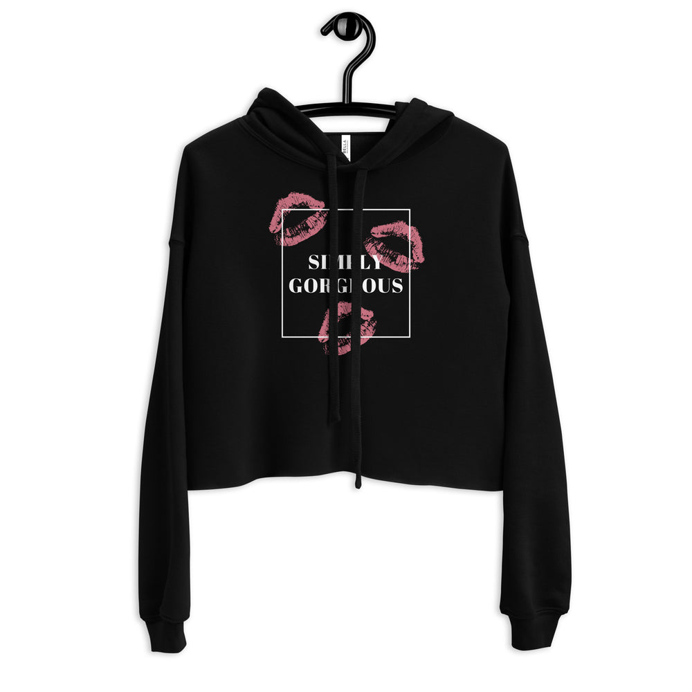 Front view of a black cropped hoodie with pink lips and “SIMPLY GORGEOUS” graphic