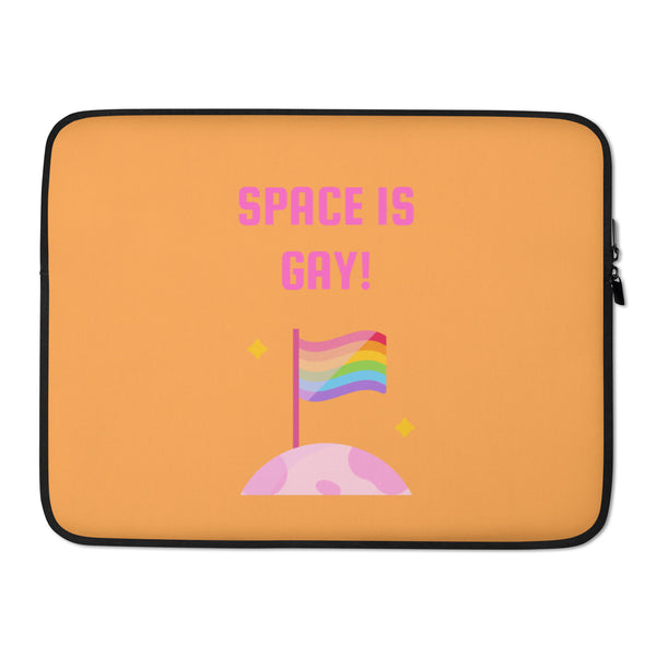 Orange laptop sleeve with pink “SPACE IS GAY!” text, rainbow flag, and moon graphic