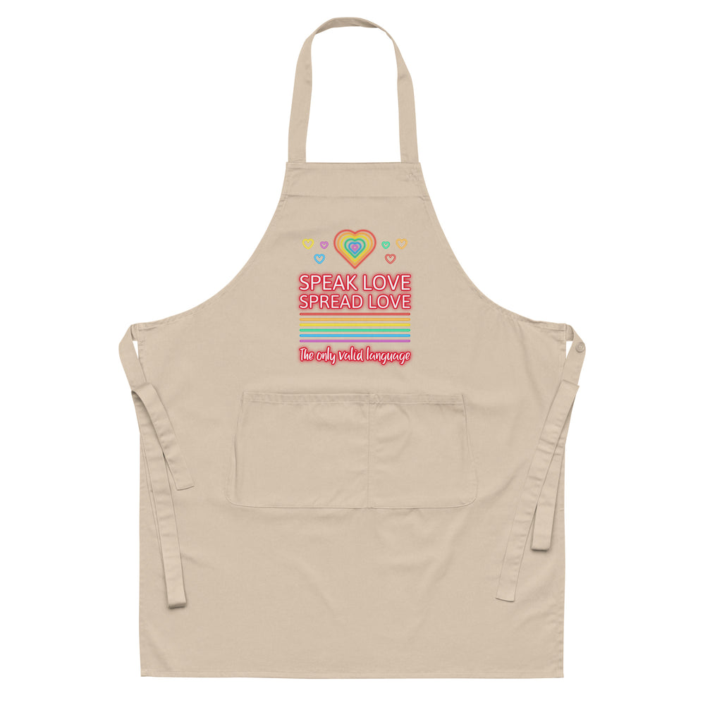 Front-facing beige apron with rainbow hearts and the words “Speak Love Spread Love.”
