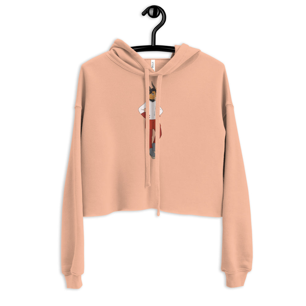Peach cropped hoodie hanging front-facing, with a small cartoon figure printed beneath the drawstrings