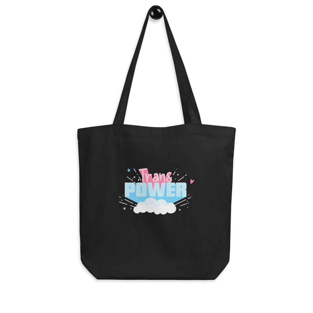 Front view of a black tote bag with colorful “Trans Power” cloud graphic