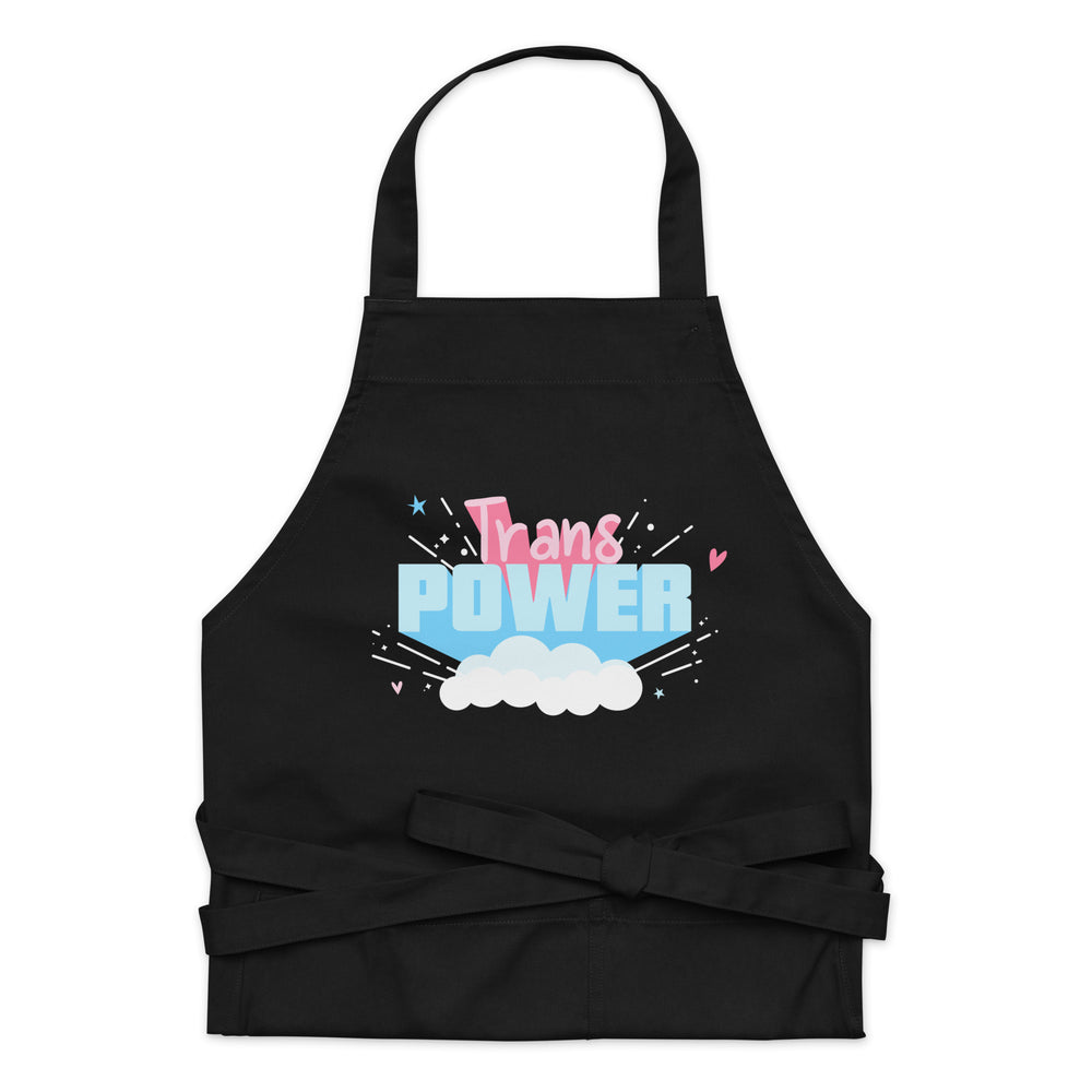 Front-facing black apron with colorful “Trans POWER” lettering, clouds, and tied waist straps