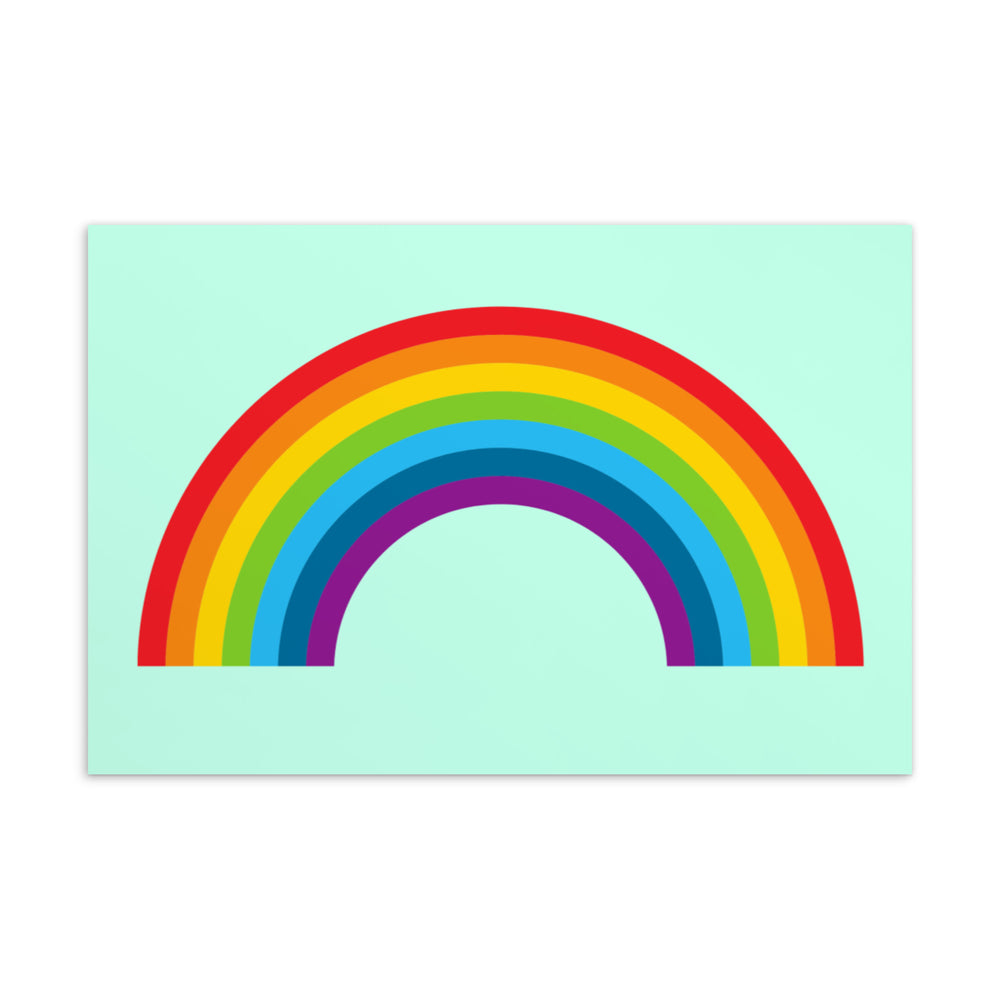 Postcard with a bold six-color rainbow arch on a pale mint background