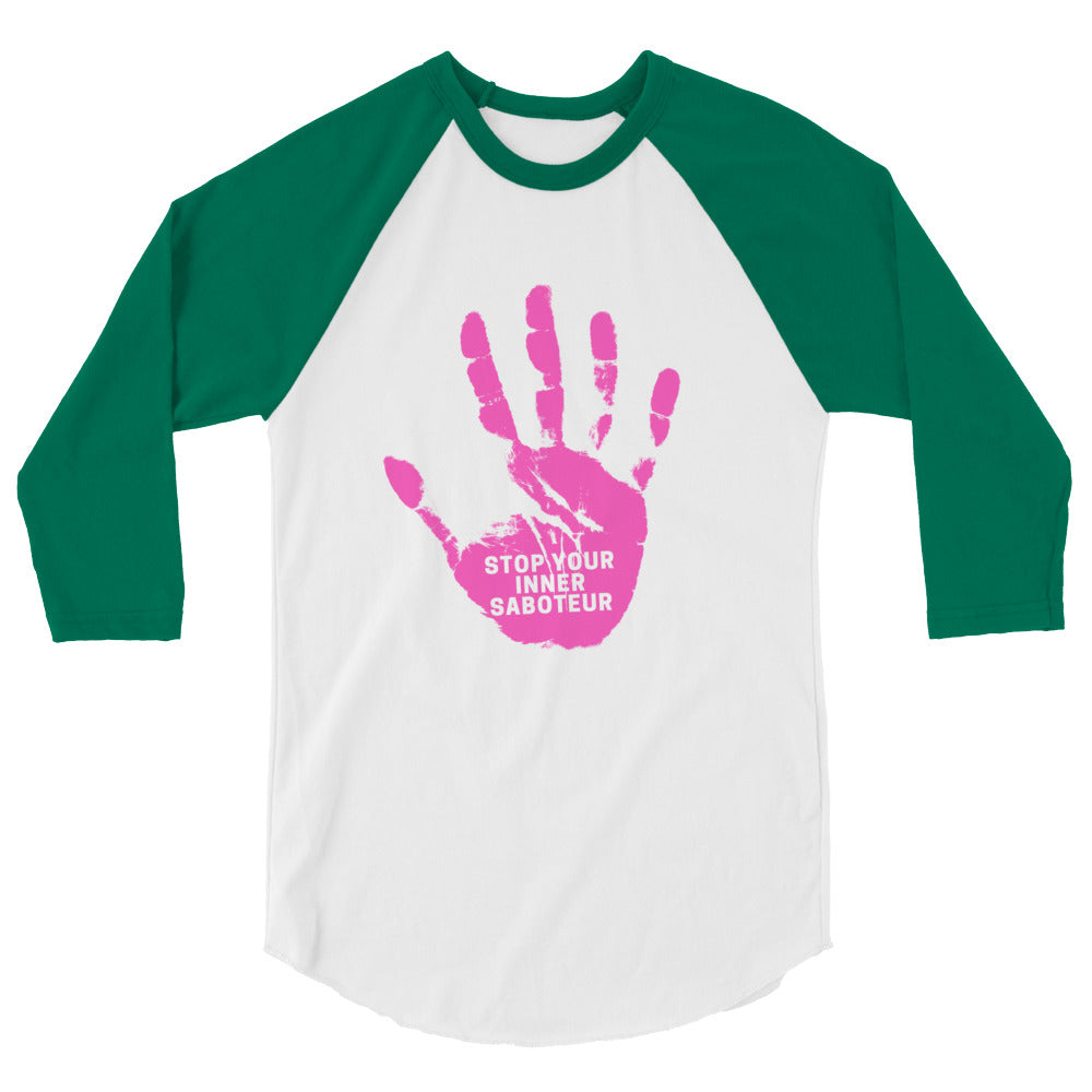 Front view of a white and green raglan shirt with a pink handprint reading “STOP YOUR INNER SABOTEUR”