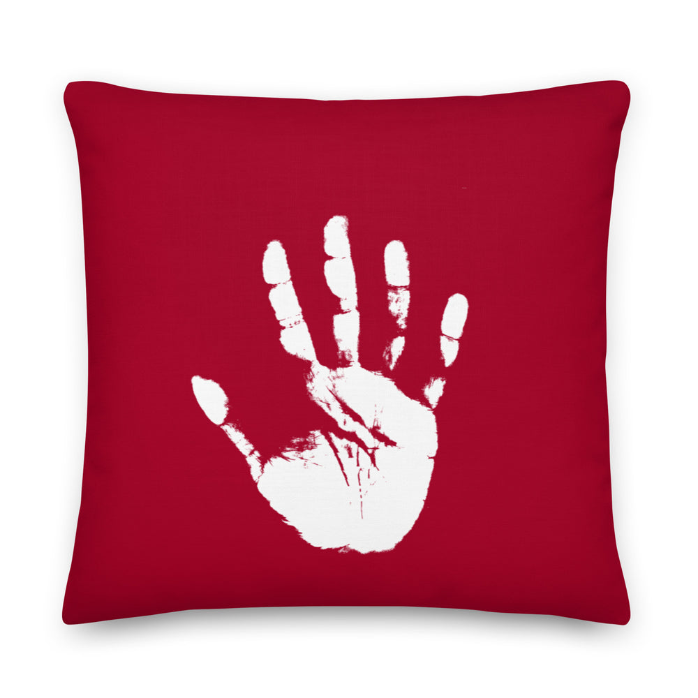 Front view of a red square pillow with a distressed white raised handprint graphic