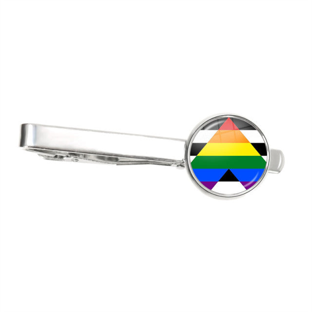 Silver tie clip with a round rainbow-striped Pride flag emblem, shown horizontally