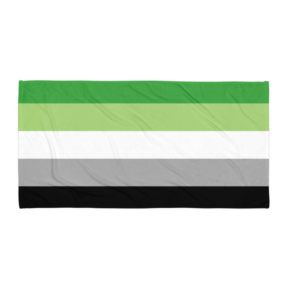 Flat-lay towel with horizontal green, light green, white, gray, and black stripes