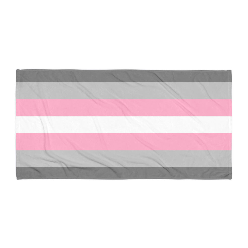Flat-laid rectangular towel with horizontal gray, pink, and white stripes