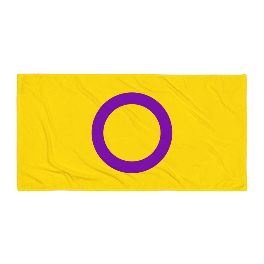 Flat-lay yellow towel with a large purple ring centered on it